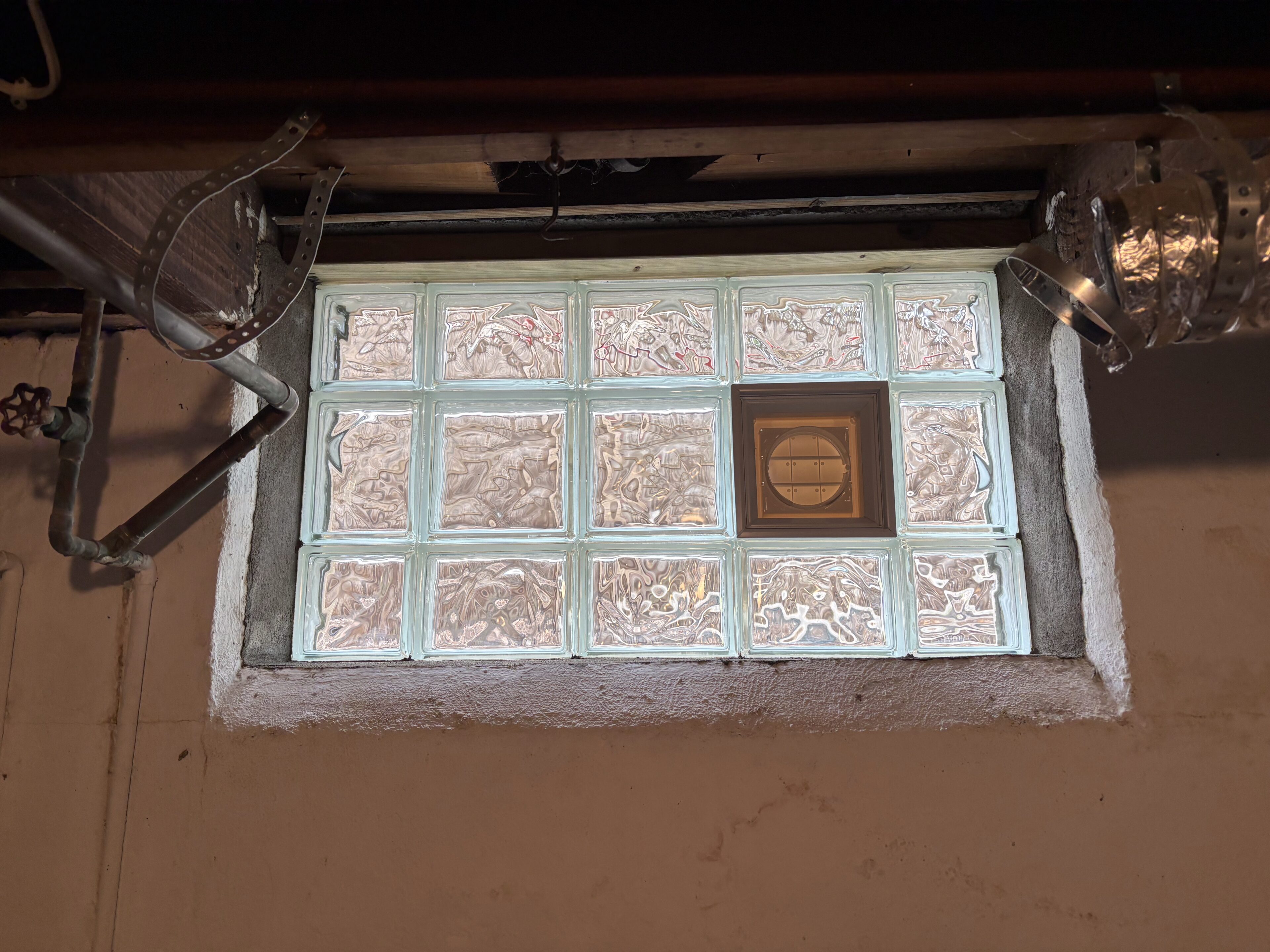 Basement window close-up with grid design